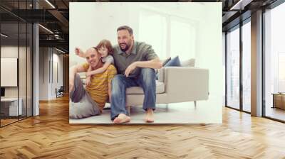 Portrait of male gay couple with adopted childre Wall mural