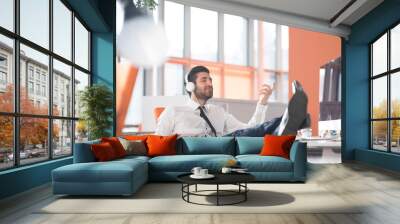 relaxed young business man at office Wall mural