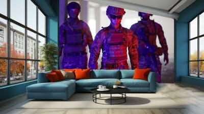 Soldier squad team walking in urban environment colored lightis Wall mural