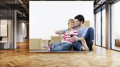 Young couple moving in new home Wall mural