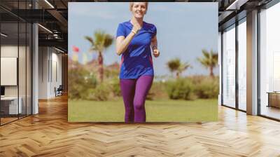 young female runner training for marathon Wall mural