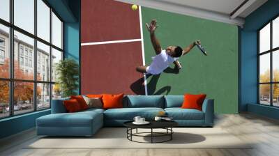 young man play tennis outdoor Wall mural