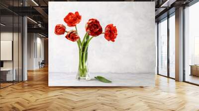 Bouquet of red tulips on a light background. Copy space Wall mural