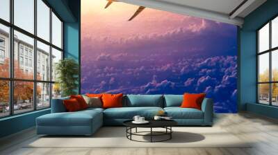 Airplane in the sky at sunrise Wall mural