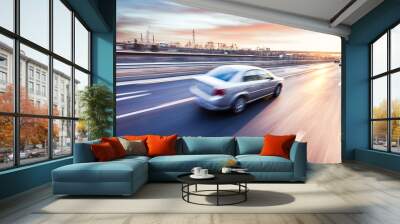 Car driving on freeway at sunset, motion blur Wall mural