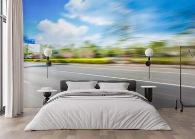 Car driving on road, motion blur Wall mural