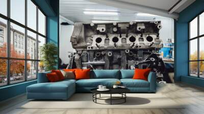 Car engine in a repair shop for overhaul and spare parts replacement. Wall mural