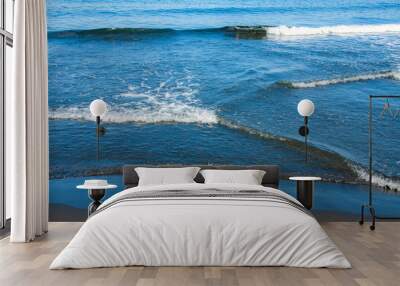 Fantastic soft wave layers on sand at the sea. Wall mural