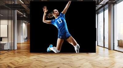 Female professional volleyball player isolated on black Wall mural