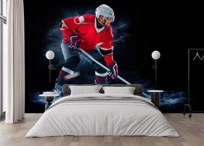 ice hockey player isolated on black background Wall mural