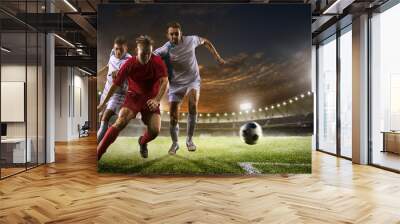 Soccer players in action on sunset stadium background panorama Wall mural