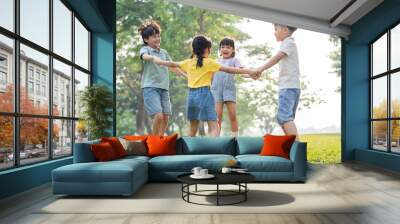 group image of asian children having fun in the park Wall mural