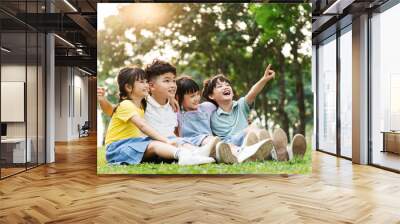 group of cute asian kids having fun in the park Wall mural