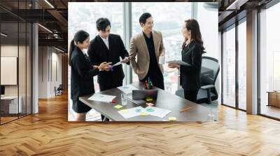 image of a group of Asian businessmen working together at the company Wall mural