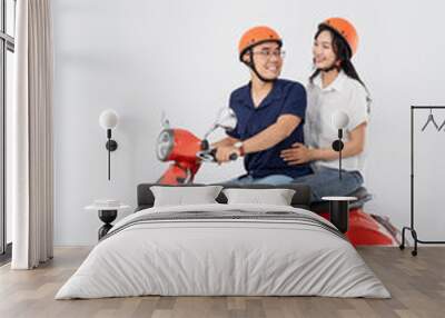 image of asian couple riding scooter on white background Wall mural