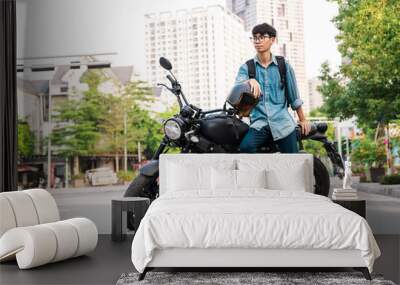 Image of Asian man sitting on his motorcycle Wall mural