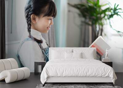 picture reading book on sofa Wall mural