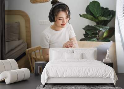 Portrait of asian girl working at home Wall mural