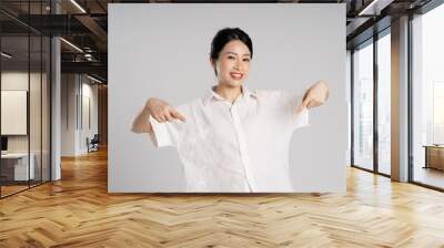 Portrait of beautiful asian woman posing on white background Wall mural