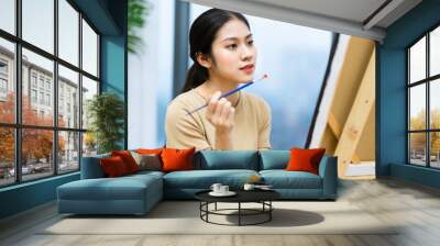 portrait of young asian girl painting Wall mural