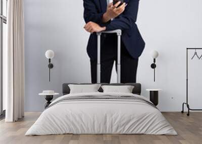 Young business man wearing a suit posing on a white background Wall mural