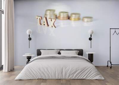 wood text TAX on coins background , business and finance concept Wall mural