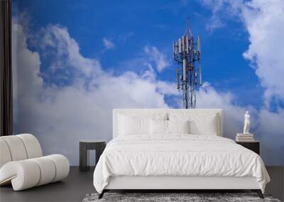 Telecommunication telephone signal transmission tower with beautiful blue sky and cloudy background Wall mural