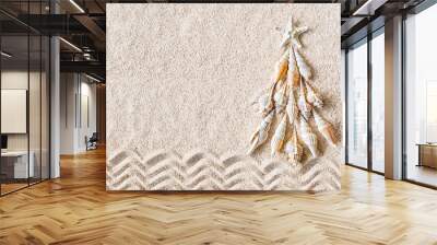 Sea shells and star fish Christmas tree on clear sand, top view Wall mural