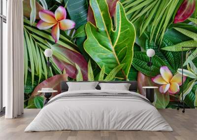 Summer tropical mix green leaves and flower background, top view Wall mural