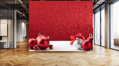 christmas balls on white table red wall Wall mural