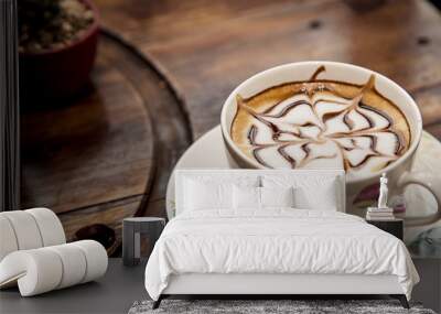 Cup of cappuccino on table Wall mural