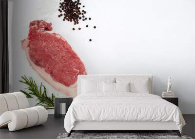 Fresh raw beef steak with spices  on white Wall mural