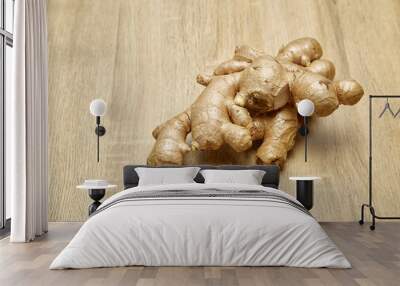 Ginger root sliced on wooden table Wall mural