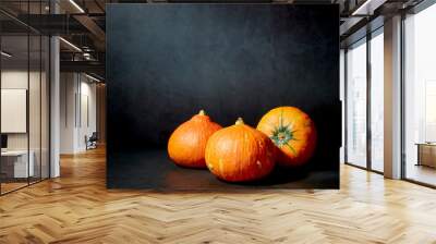 Three Pumpkins in black background Wall mural