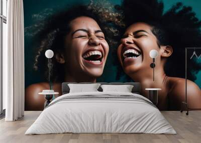 Two mix race afro American women are laughing against a blue background, generative ai Wall mural