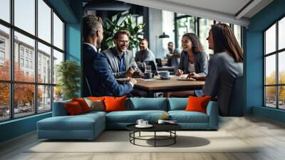 People engaged in lively conversation around a table Wall mural