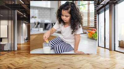 Daughter put cookie to milk in kitchen Wall mural