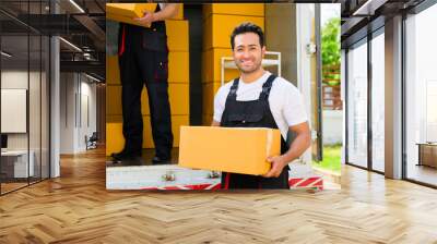 Happy two delivery men in front of delivery truck, Delivery men checking order of moving service and relocation service Wall mural