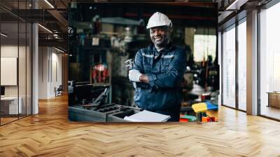 Professional male industrial worker in white hard hat working at manufacturing plant, Industrial engineer portrait Wall mural