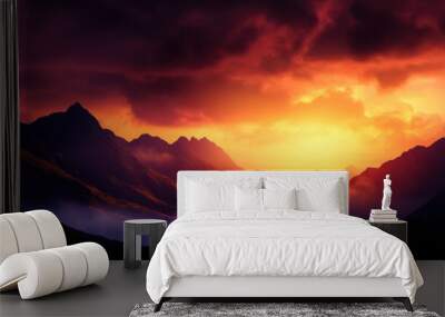 Spectacular mountain sunset with vibrant colors and dramatic cloud formations over misty peaks, creating a breathtaking scenic view. Wall mural