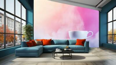 Steam rising from a white coffee cup on a colorful background. Wall mural