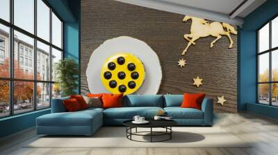 Yellow cheesecake with chocolate balls. Icons of the stars and t Wall mural