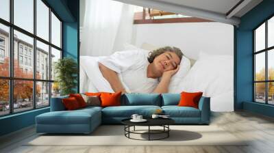 Asian Elderly woman with white hairs close eyes smile sleep and sweet dream on bed in cozy bedroom in the morning feeling so relax and comfortable,Healthcare and Sleep Concept Wall mural