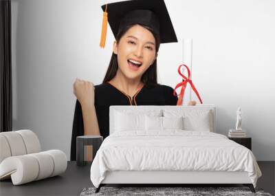 Beautiful Attractive Asian woman graduated in cap and gown smile with certificated in her hand feeling so proud and happiness,Isolated on white background,Education Success Concept Wall mural