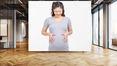 Happy Pregnant Woman standing smile and stroking big belly with love isolated on white background,Pregnancy of young woman enjoy with future life,Motherhood and Pregnant Concept Wall mural