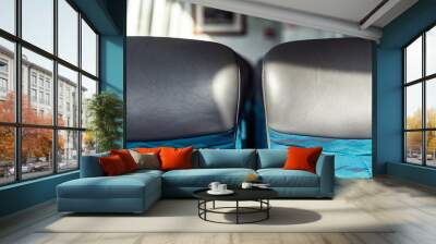 Two empty seats inside a ferry boat. Wall mural