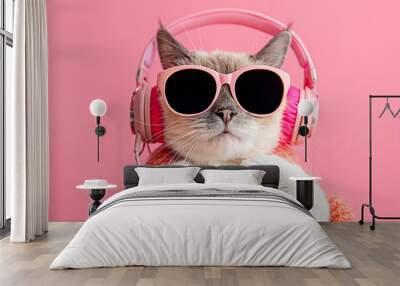 cheerful cat listens to music with trendy sunglasses on a color background Wall mural