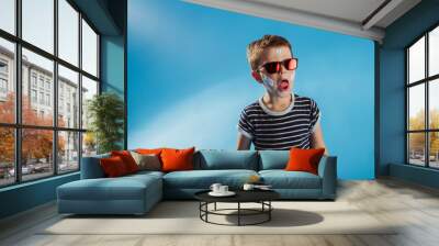 Funny school kid having fun in a studio Wall mural