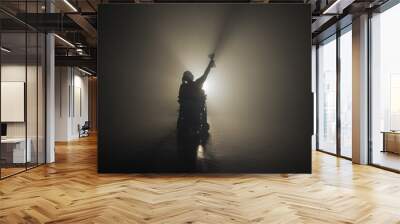 Woman with disability receiving a victory cup while sitting in a wheelchair in a dark room with one white backlight. Wall mural