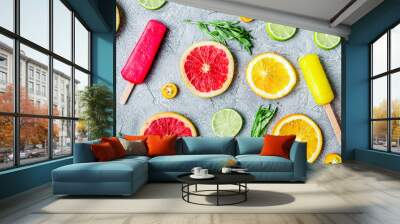 citrus slices with fruit popsicles on table background top view pattern Wall mural